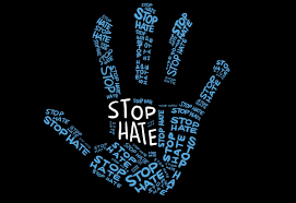 a blue and white handprint made of the words "Stop Hate"